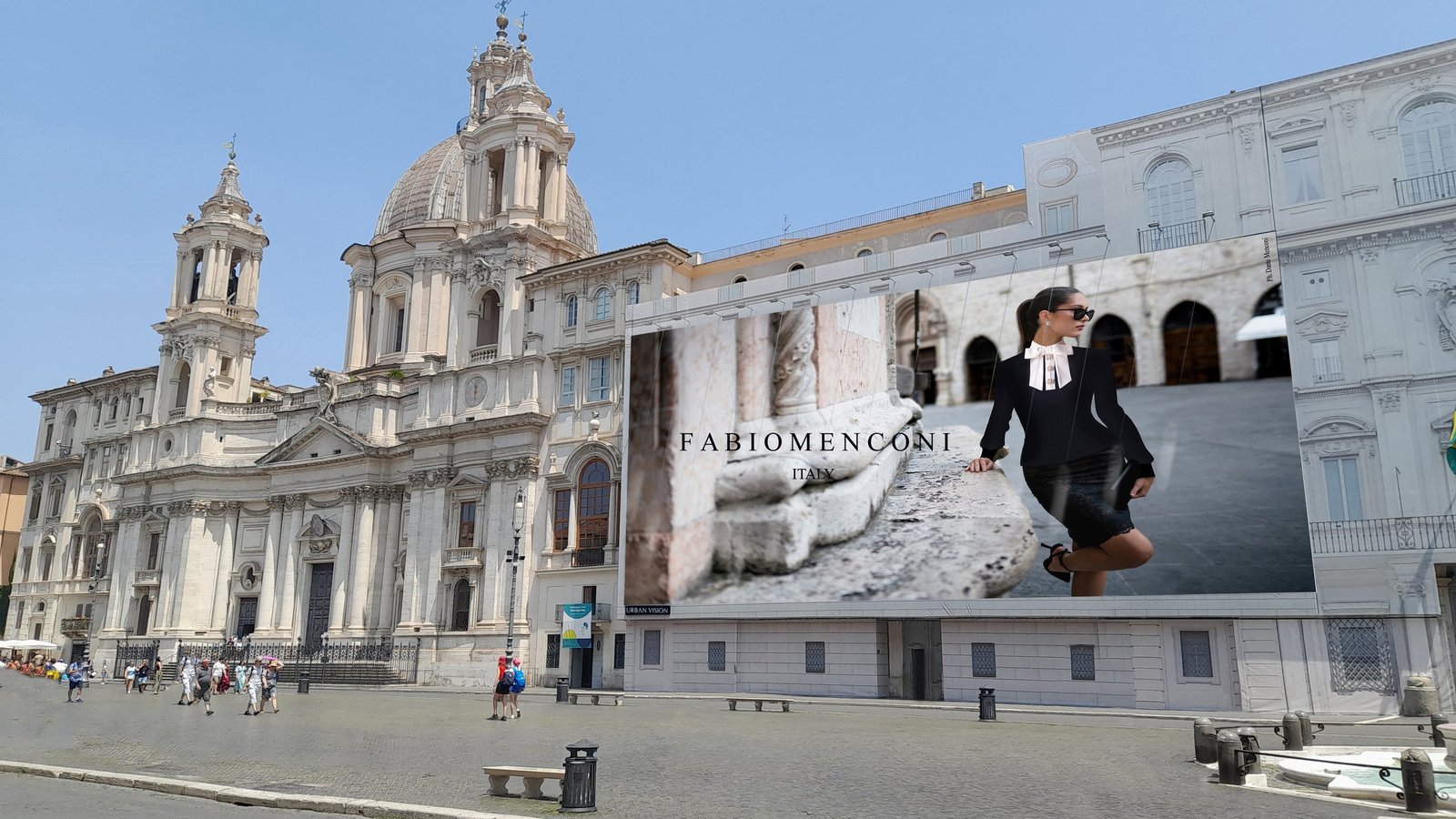 A Fabio Menconi campaign banner on a building facade in a Roman piazza.